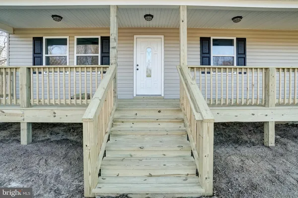 a view of wooden door with a small cabin