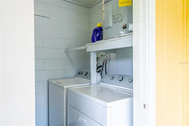 a utility room with dryer and washer