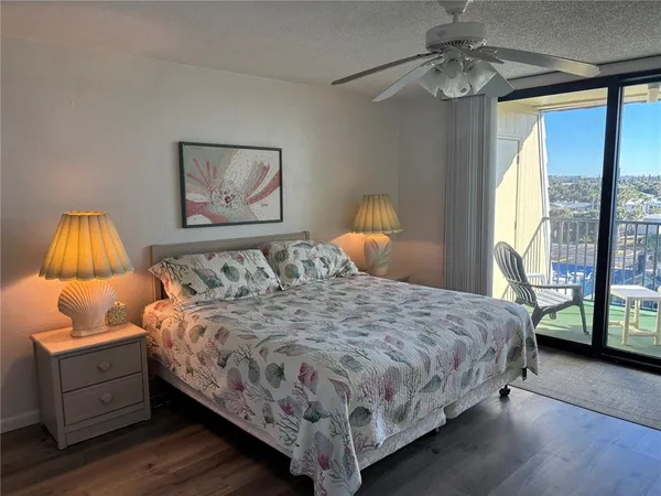 a bedroom with a bed and a television