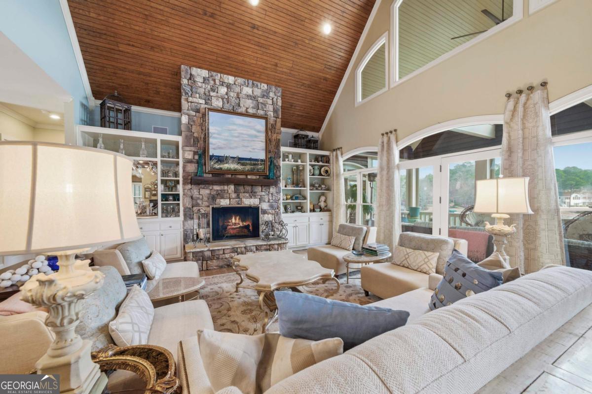 1691 Lighthouse Circle Greensboro, GA 30642 - Photo 15 of 75 a living room with furniture fireplace and a large window