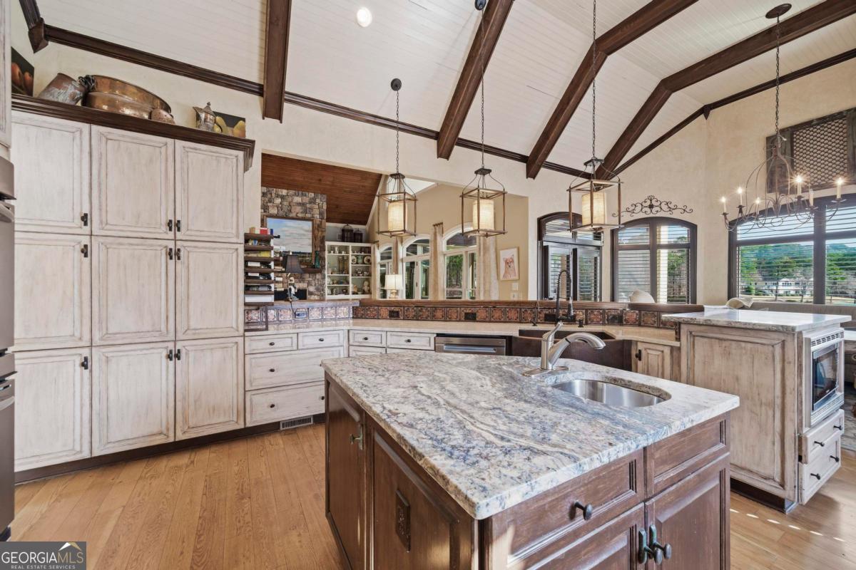 1691 Lighthouse Circle Greensboro, GA 30642 - Photo 18 of 75 a kitchen with counter top space and stainless steel appliances