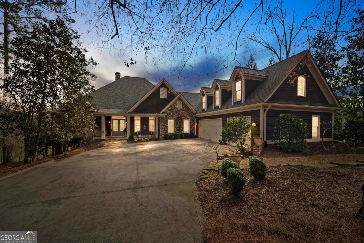 1691 Lighthouse Circle Greensboro, GA 30642 - Photo 2 of 75 a front view of a house with a yard