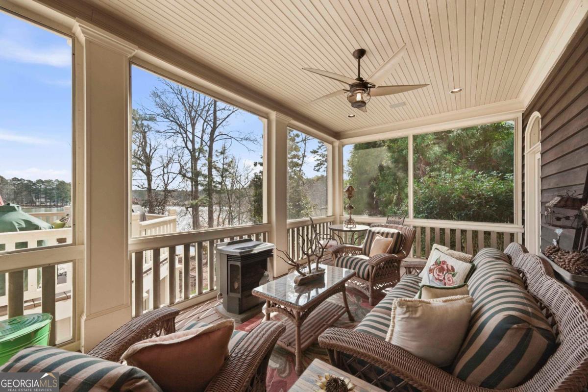 1691 Lighthouse Circle Greensboro, GA 30642 - Photo 23 of 75 a living room with furniture and a large window