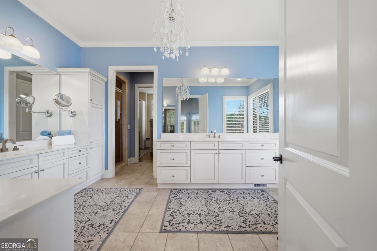1691 Lighthouse Circle Greensboro, GA 30642 - Photo 29 of 75 a bathroom with a sink a vanity a mirror and a shower