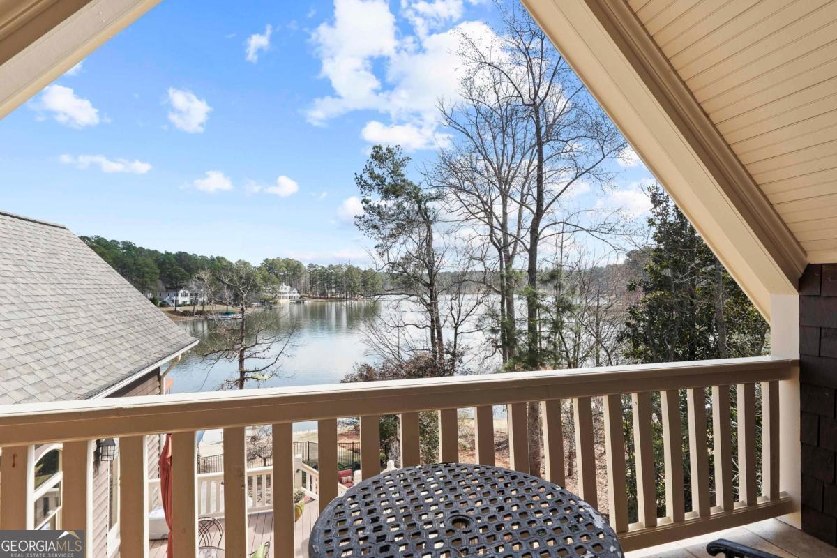1691 Lighthouse Circle Greensboro, GA 30642 - Photo 46 of 75 a balcony view with a lake view