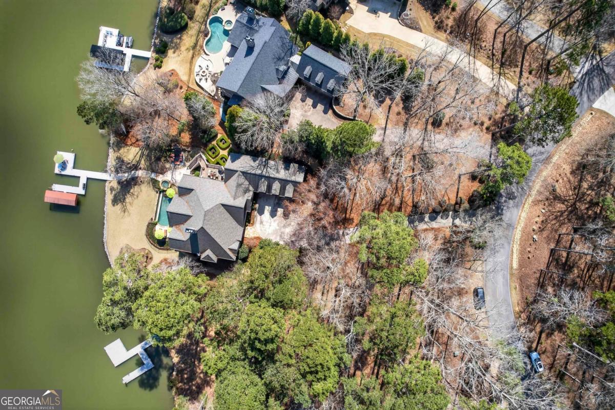 1691 Lighthouse Circle Greensboro, GA 30642 - Photo 5 of 75 an aerial view of a house with a yard basket ball court and outdoor seating