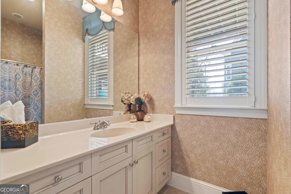 1691 Lighthouse Circle Greensboro, GA 30642 - Photo 52 of 75 a bathroom with a sink and a mirror