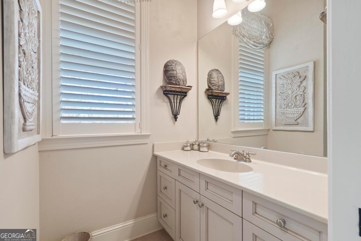 1691 Lighthouse Circle Greensboro, GA 30642 - Photo 54 of 75 a bathroom with a sink and a mirror