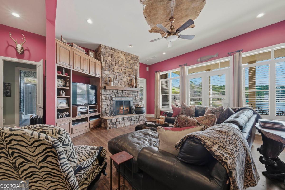 1691 Lighthouse Circle Greensboro, GA 30642 - Photo 63 of 75 a bedroom with a bed couch and large window