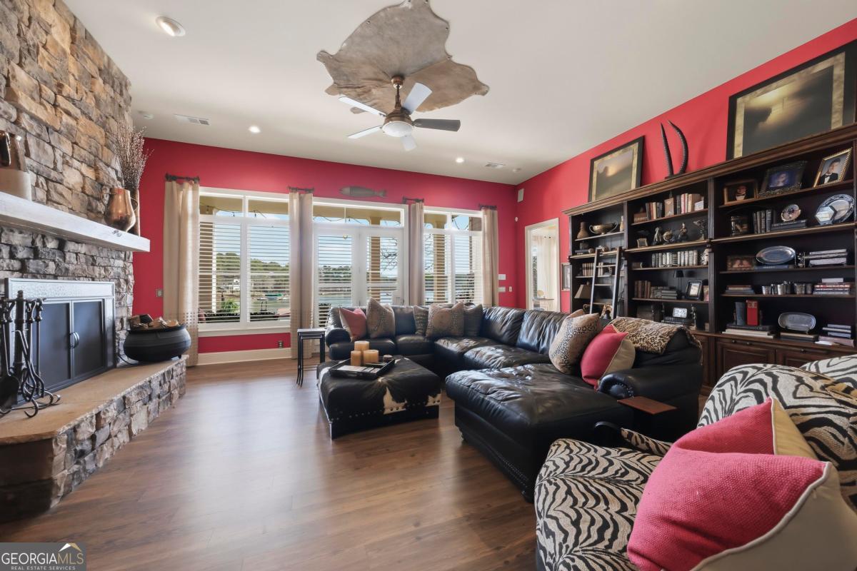 1691 Lighthouse Circle Greensboro, GA 30642 - Photo 64 of 75 a living room with furniture a rug and a chandelier