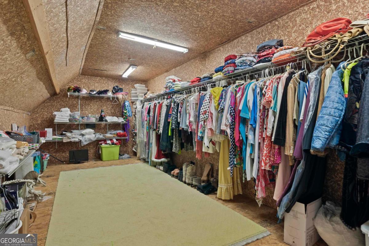 1691 Lighthouse Circle Greensboro, GA 30642 - Photo 73 of 75 a view of walk in closet with clothes