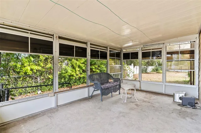 a room with furniture and a large window