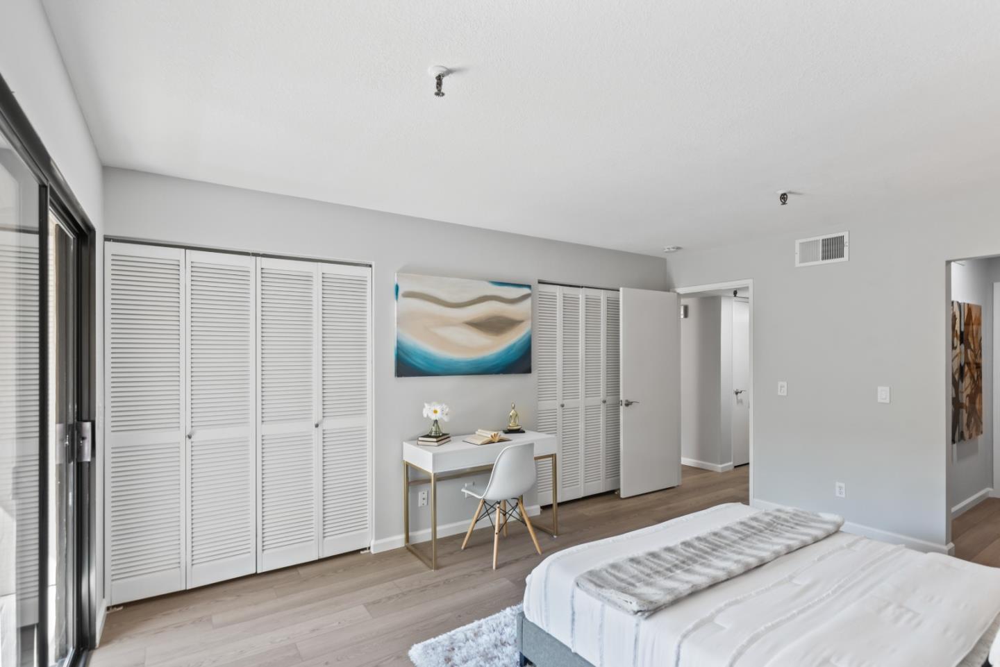 49 Showers Drive, Unit E250 Mountain View, CA 94040 - Photo 14 of 27 a bedroom with a bed and a window