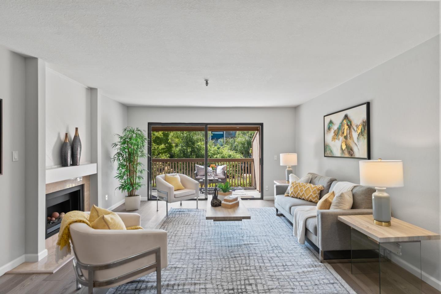 49 Showers Drive, Unit E250 Mountain View, CA 94040 - Photo 2 of 27 a living room with furniture and a large window