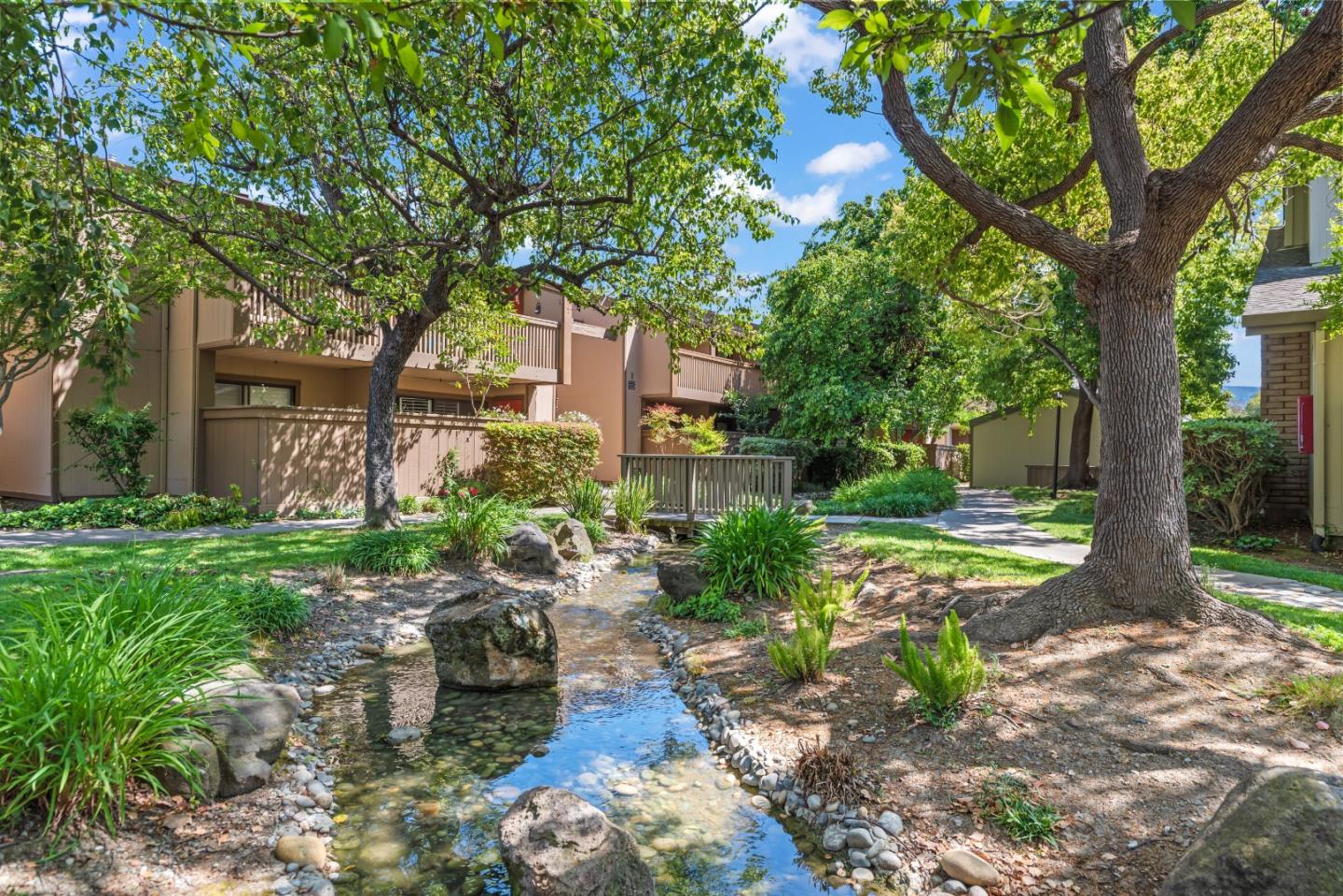 49 Showers Drive, Unit E250 Mountain View, CA 94040 - Photo 21 of 27 a front view of a house with garden