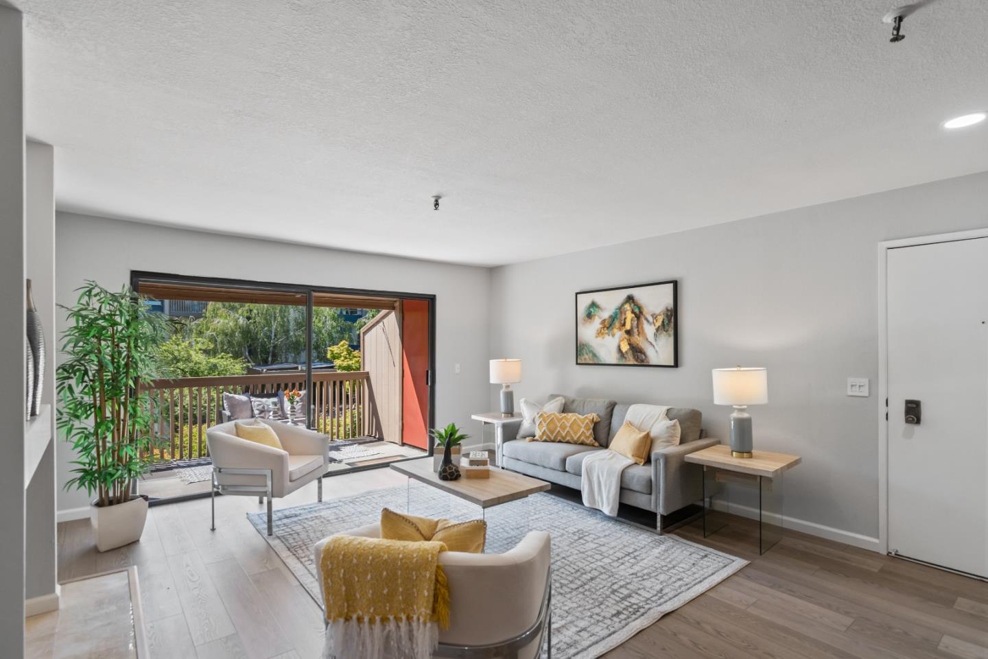 49 Showers Drive, Unit E250 Mountain View, CA 94040 - Photo 3 of 27 a living room with furniture and a large window