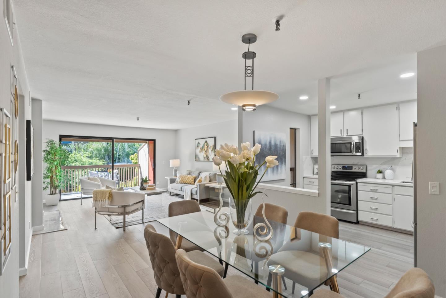 49 Showers Drive, Unit E250 Mountain View, CA 94040 - Photo 8 of 27 a living room with furniture dining table and a large window