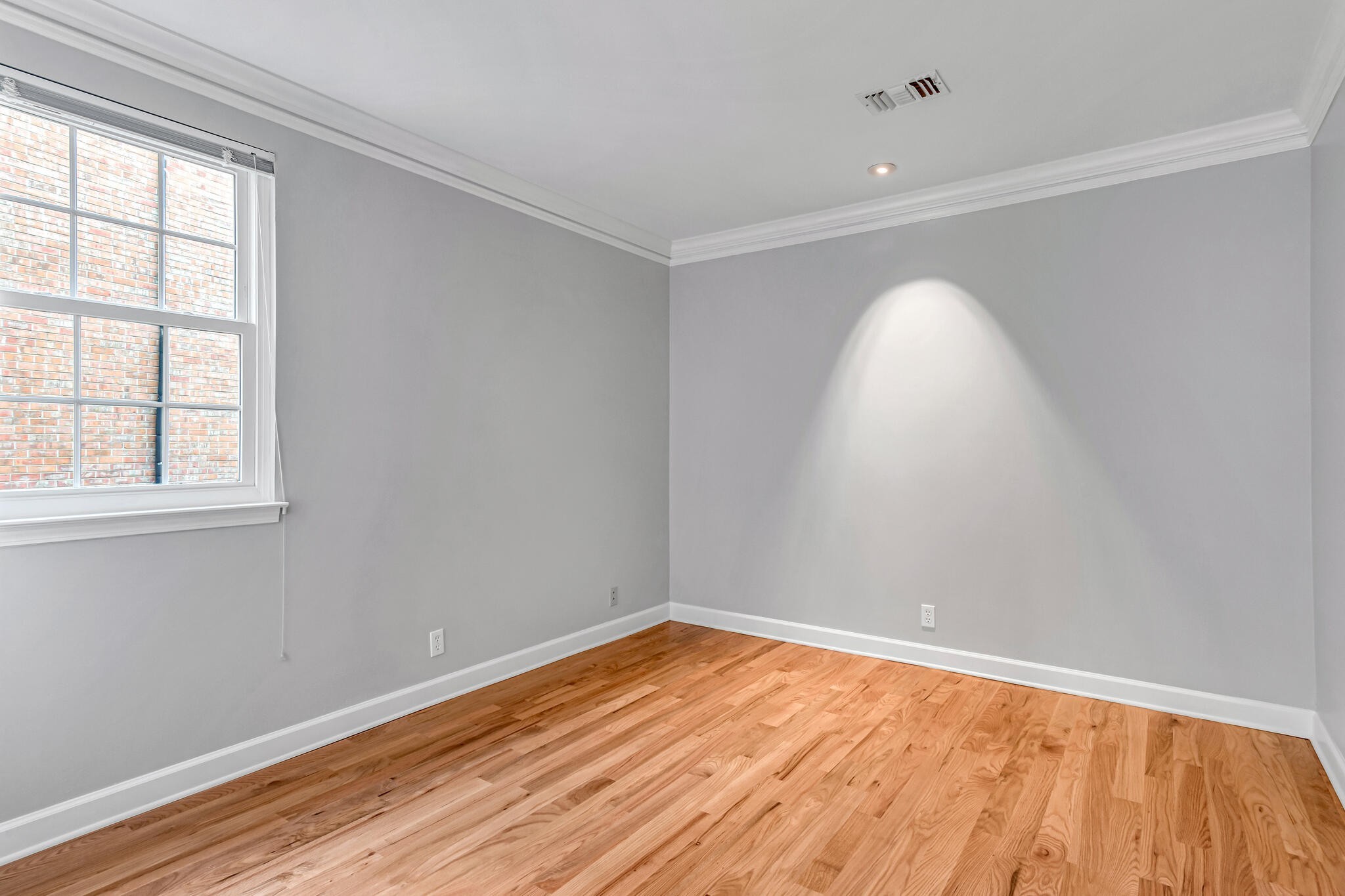 734 General George Patton Road Nashville, TN 37221 - Photo 25 of 29 an empty room with wooden floor and windows