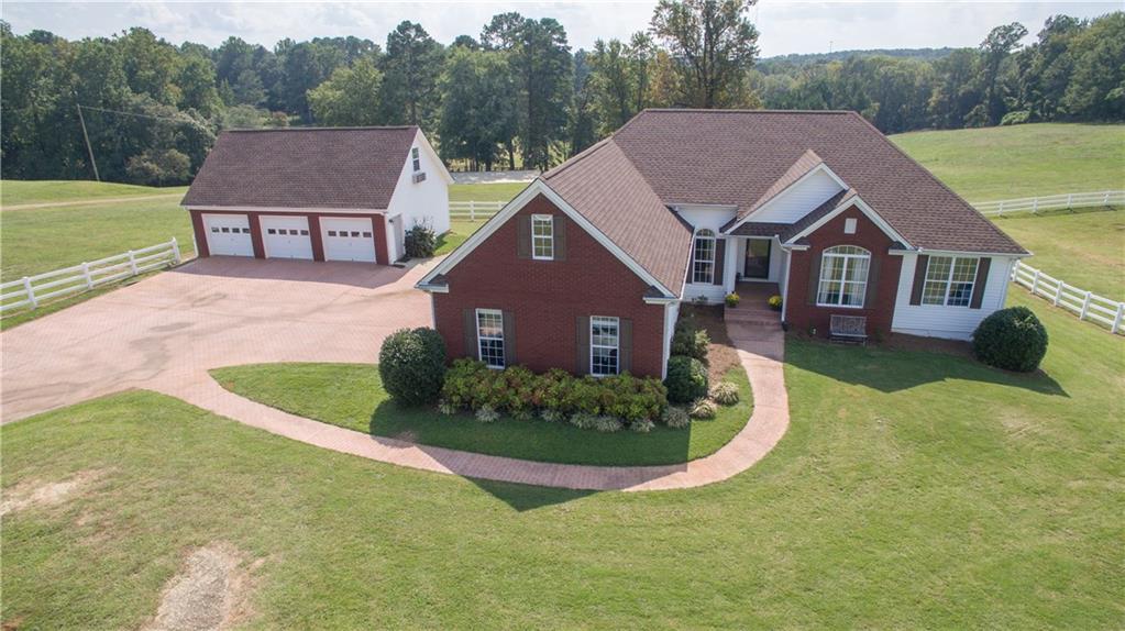 988 Carl Bramlett Road Winder, GA 30680 - Photo 1 of 1 Ranch with finished basement, on 27 acres with a 5 car garage and pond and bar.