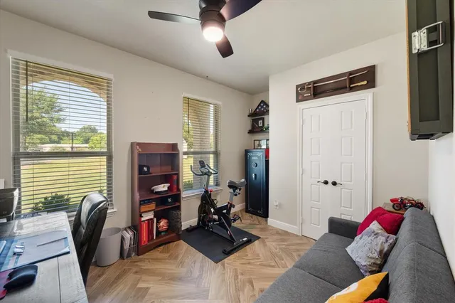 a bedroom with furniture and a window