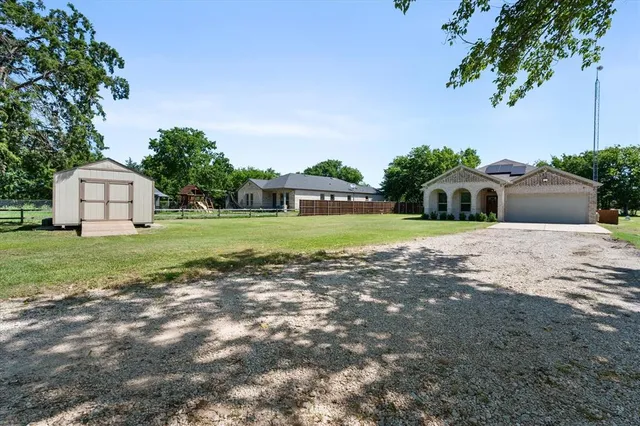 a view of a house with a big yard