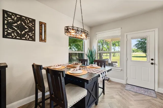 a view of a dining room with furniture window and outside view
