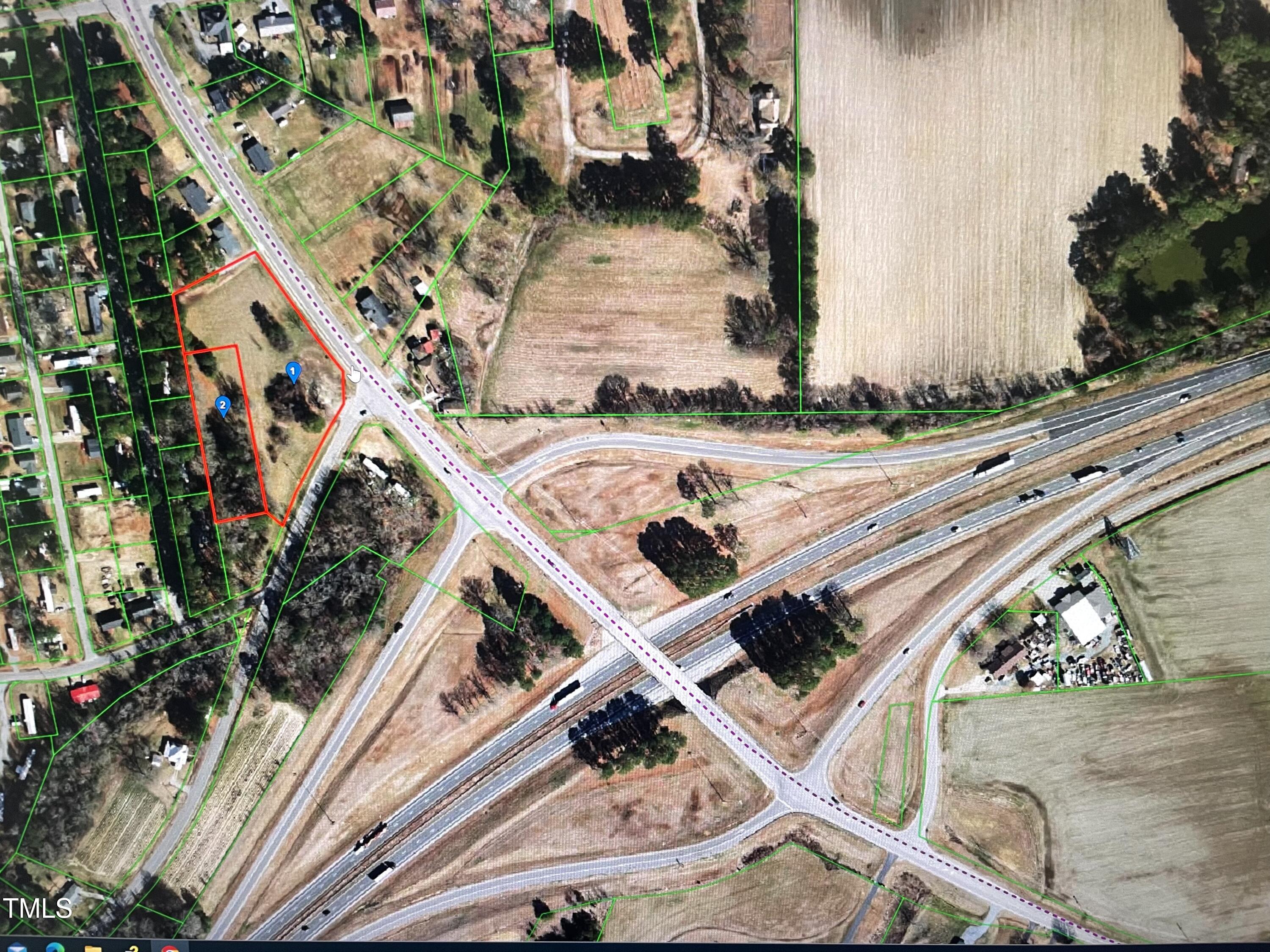 an aerial view of a house with a swimming pool