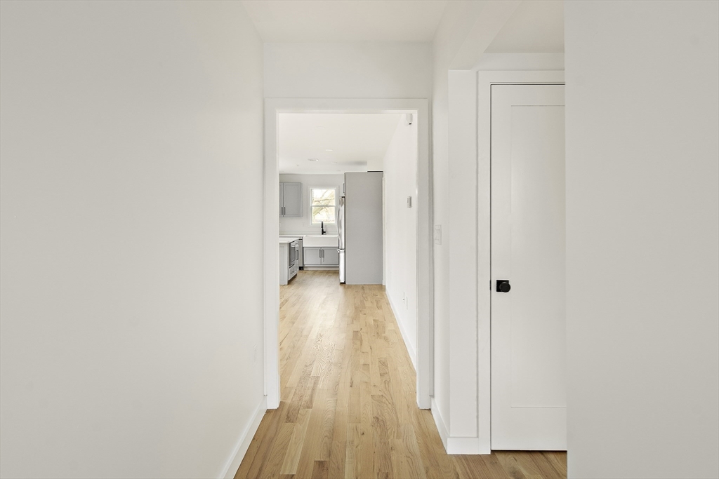 25 Hillsboro Street, Unit 1 Boston, MA 02125 - Photo 10 of 14 a view of a room with wooden floor