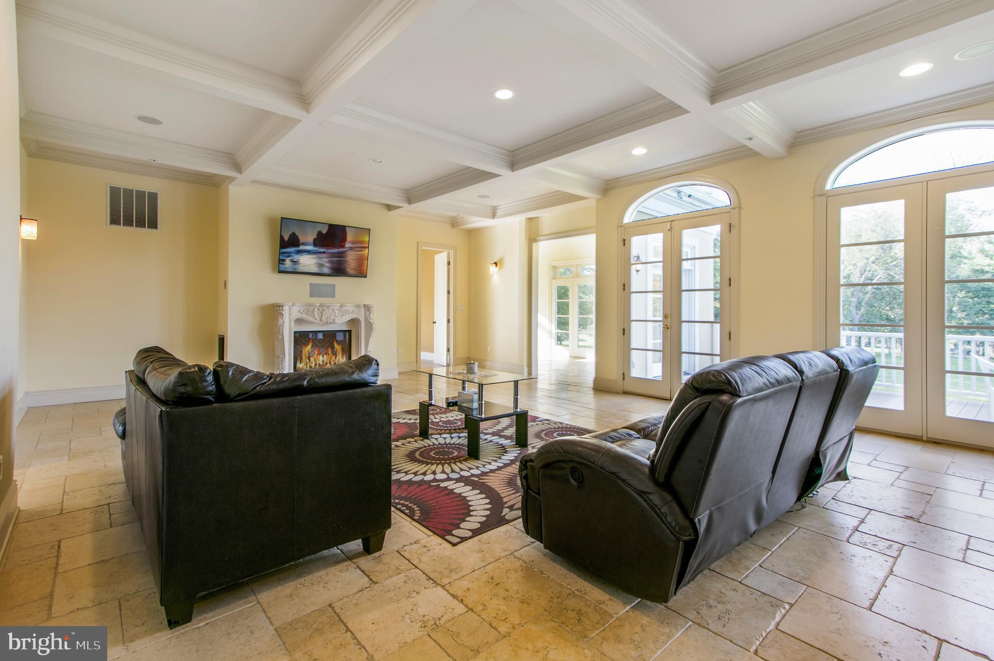 16434 Oak Hill Road Silver Spring, MD 20905 - Photo 34 of 90 a living room with furniture and large windows