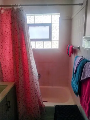 a view of walk in closet with window