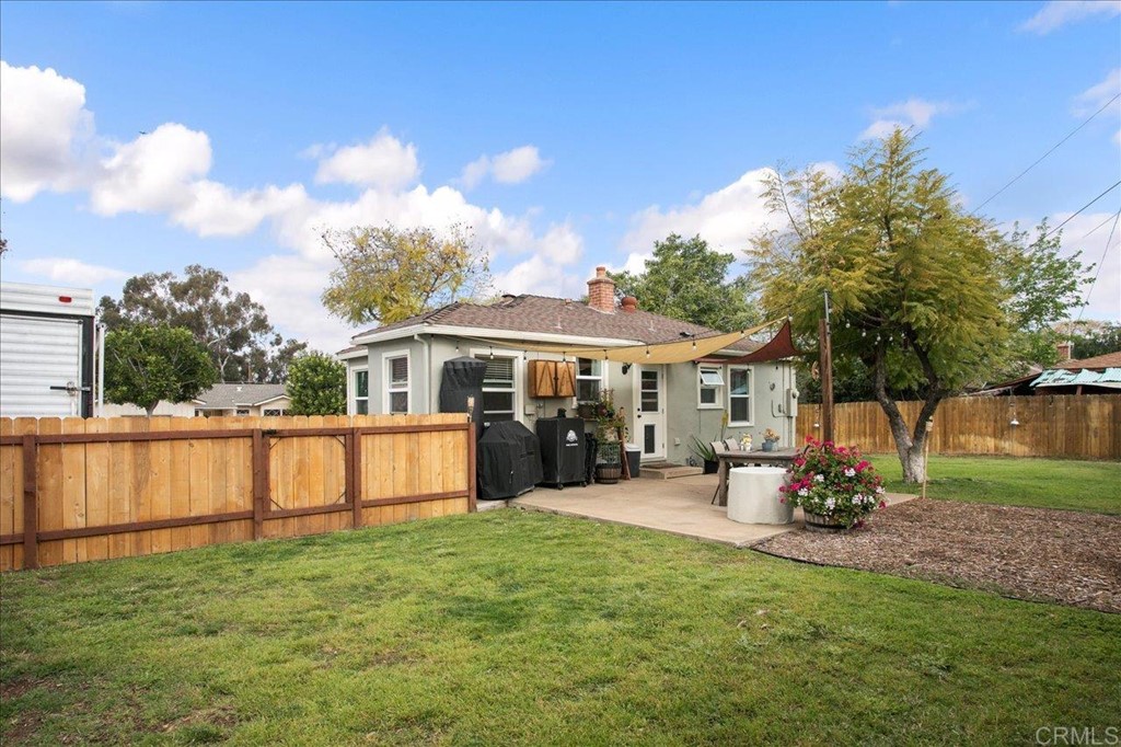 4989 Porter Hill Road La Mesa, CA 91942 - Photo 19 of 22 a view of a house with backyard porch and sitting area
