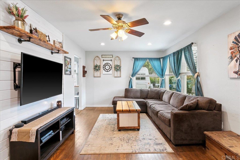 4989 Porter Hill Road La Mesa, CA 91942 - Photo 2 of 22 a living room with furniture and a flat screen tv