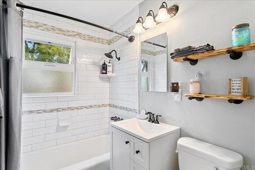 4989 Porter Hill Road La Mesa, CA 91942 - Photo 6 of 22 a bathroom with a sink mirror vanity and toilet