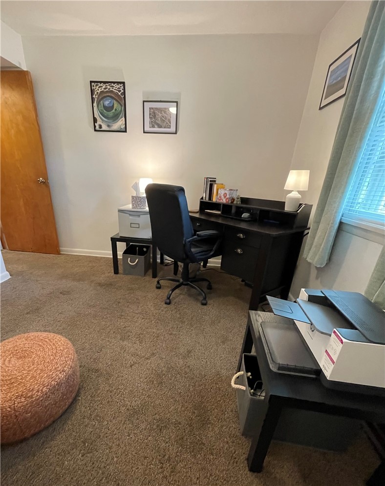 360 Ridge Street Piqua, OH 45356 - Photo 25 of 46 This cozy study offers a functional workspace with soft carpet flooring and ample natural light.