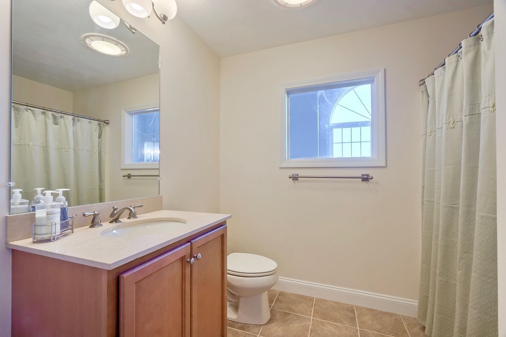 8 A Turtle Hill Road, Unit 8A Ayer, MA 01432 - Photo 22 of 35 a bathroom with a sink a toilet and a mirror