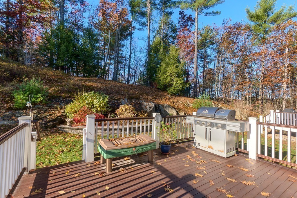 8 A Turtle Hill Road, Unit 8A Ayer, MA 01432 - Photo 23 of 35 a view of balcony with wooden floor and outdoor seating