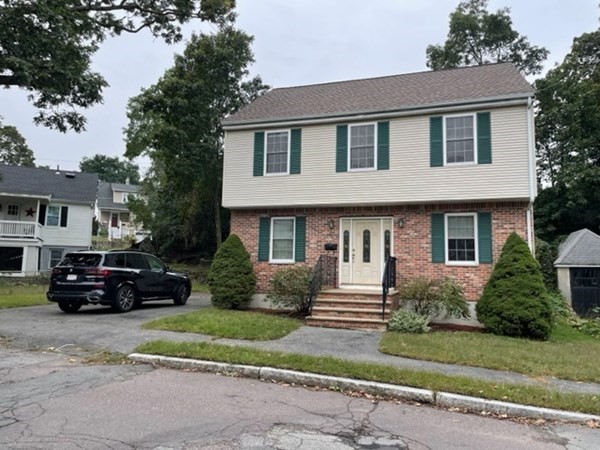 a view of a car parked in front of a house