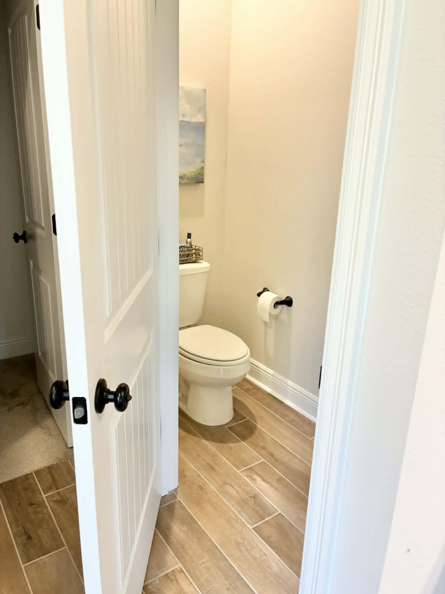 225 Hydrangea Boulevard Freeport, FL 32439 - Photo 8 of 11 a bathroom with a toilet and a shower