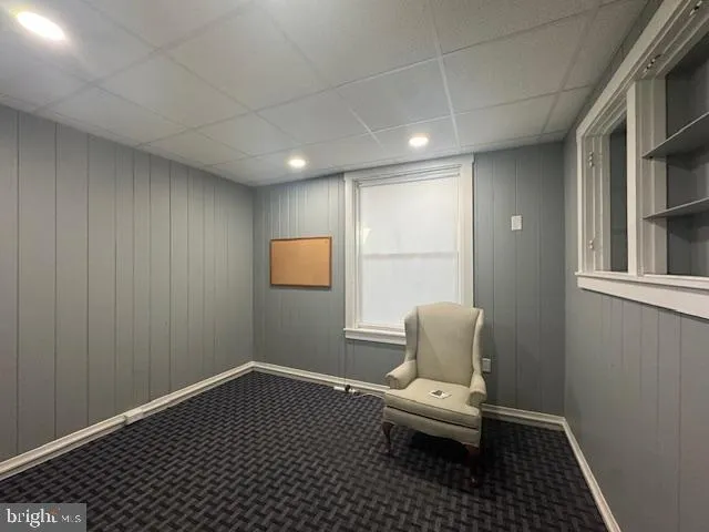 a bathroom with a toilet and a window