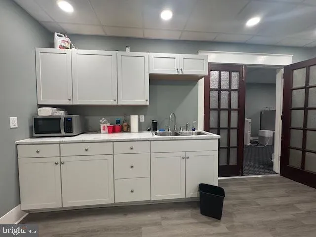 a kitchen with a sink cabinets and window