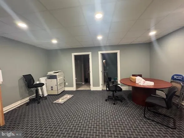 a work room with a table and chairs