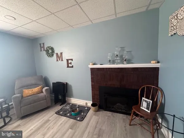 a bedroom with furniture and a flat screen tv