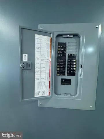 a front view of small house with yard and outdoor seating