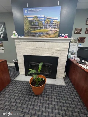 a room with furniture and a fireplace