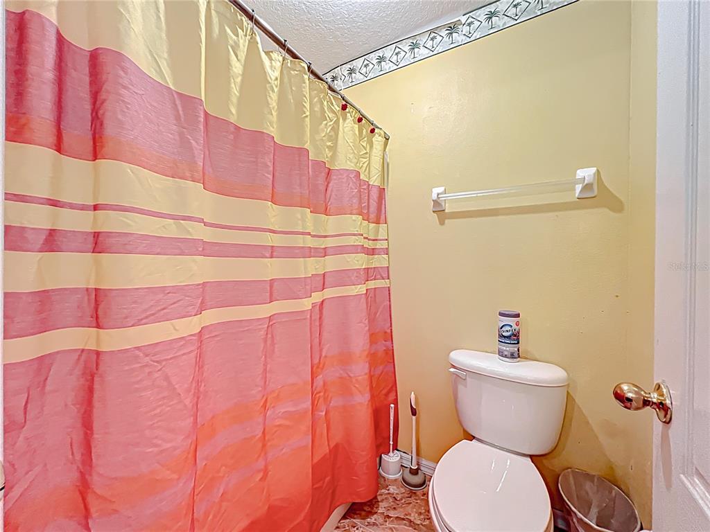 7939 Riffle Lane Orlando, FL 32818 - Photo 36 of 52 a bathroom with a sink and toilet