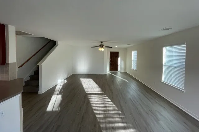 a view of gallery with wooden floor