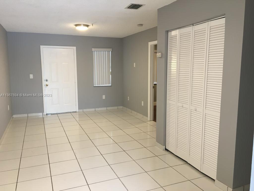 1852 Southwest 7th Street, Unit 309 Miami, FL 33135 - Photo 1 of 12 a view of an empty room and window