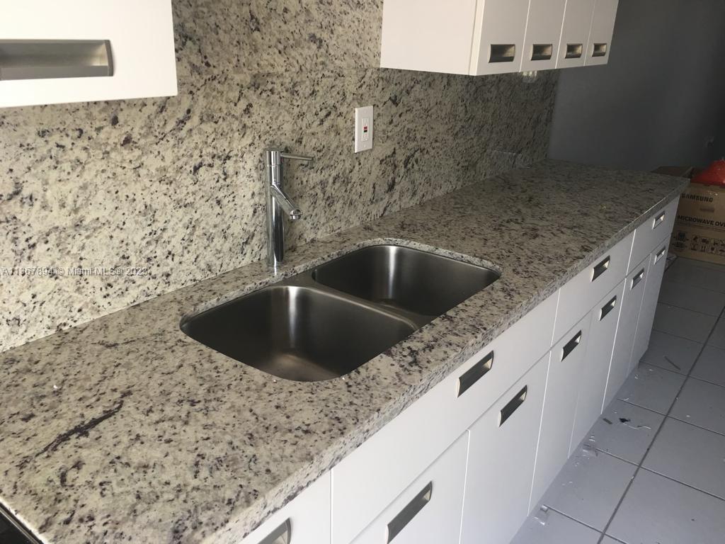 1852 Southwest 7th Street, Unit 309 Miami, FL 33135 - Photo 3 of 12 a close view of sink and tap
