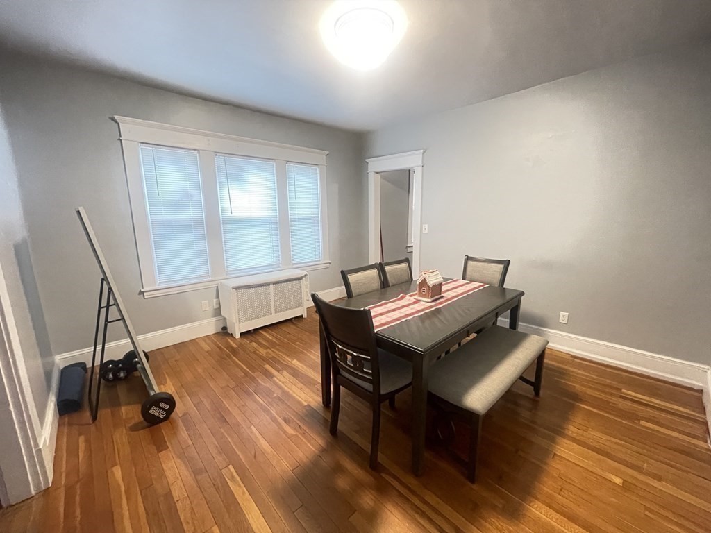 32-34 Rittenhouse Terrace Springfield, MA 01108 - Photo 18 of 23 a living room with a table chairs and wooden floor