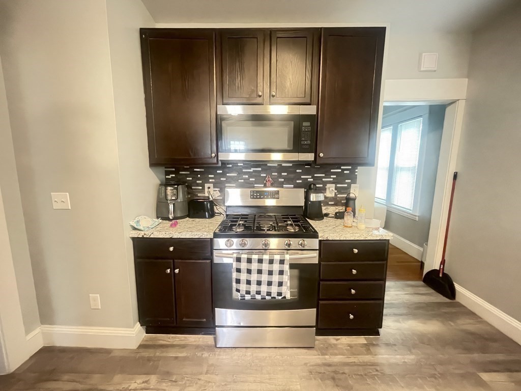32-34 Rittenhouse Terrace Springfield, MA 01108 - Photo 2 of 23 a kitchen with a stove and a refrigerator